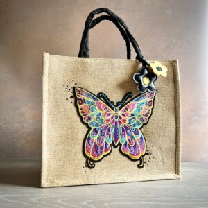 Colourful butterfly gift bag with embroidered butterfly design and flower charm – Pomme d’Or.