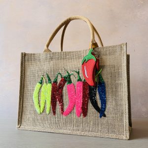 Colourful chilli jute shopping bag with sparkling sequin chilli appliqué and detachable chilli-shaped purse, hand embellished by Pomme d'Or.