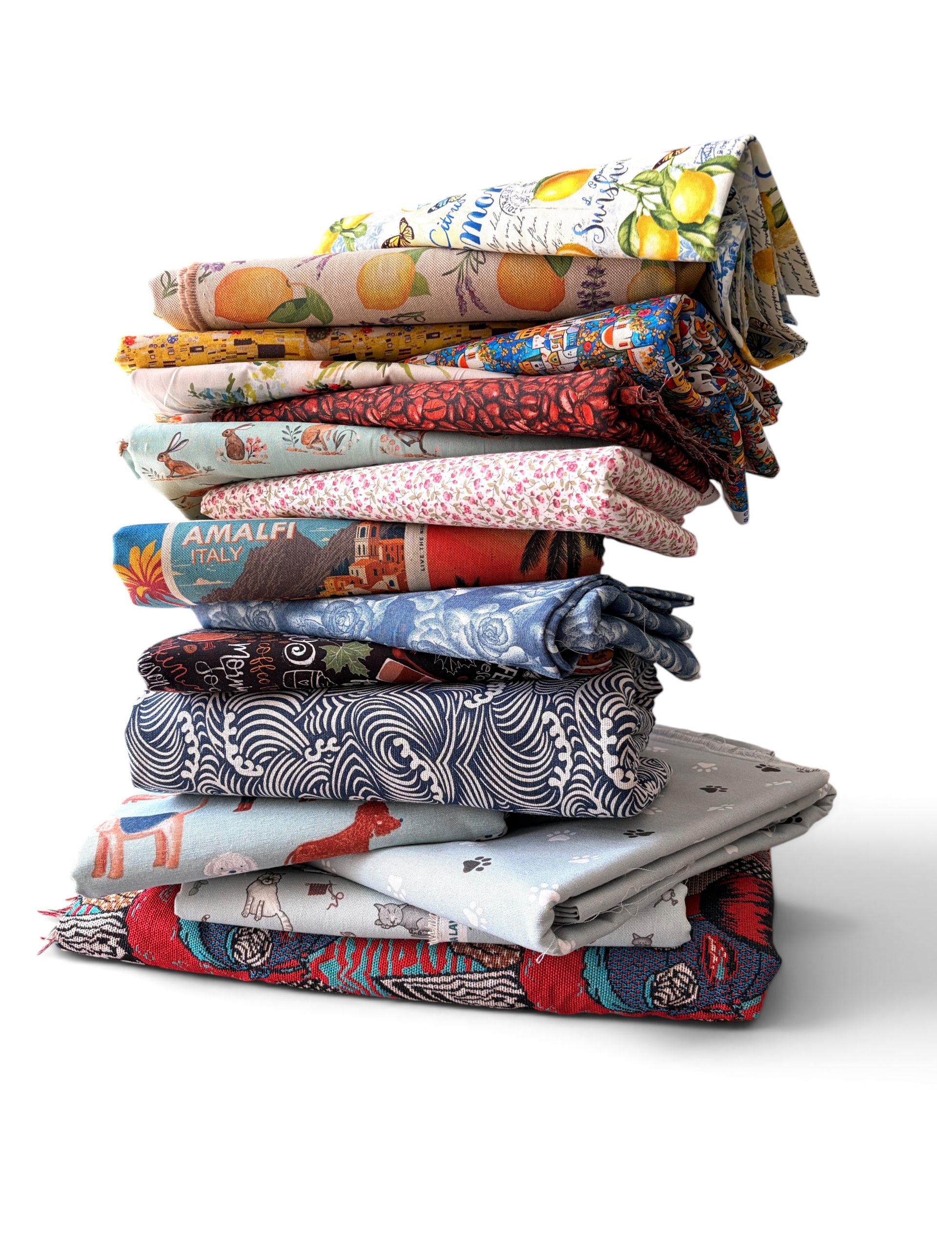 Stack of colourful fabrics collected for handmade bag making and creative projects