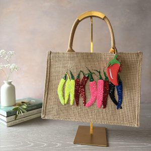 Colourful chilli jute shopping bag with sparkling sequin chilli appliqué and detachable chilli-shaped purse, hand embellished by Pomme d'Or.