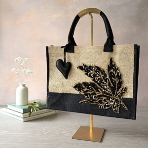 Black and gold leaf jute gift bag with sequinned leaf embroidery and heart charm – Pomme d’Or.