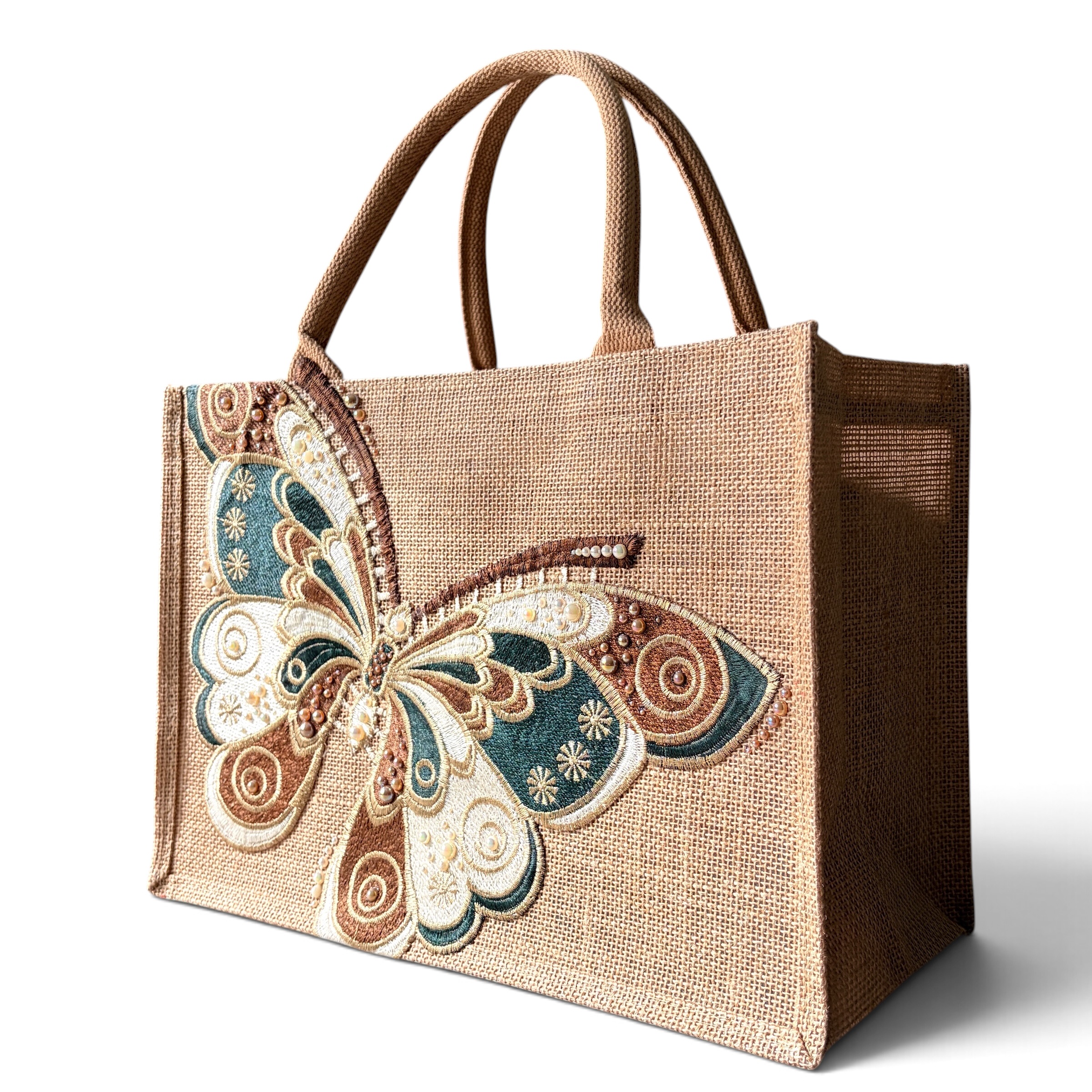 Three-quarter view of Sylvan butterfly jute bag showing the embroidered butterfly design and wide side gusset.